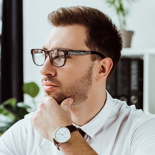 handsome-pensive-businessman-with-paperwork-and-la-JQXMEUW.jpg